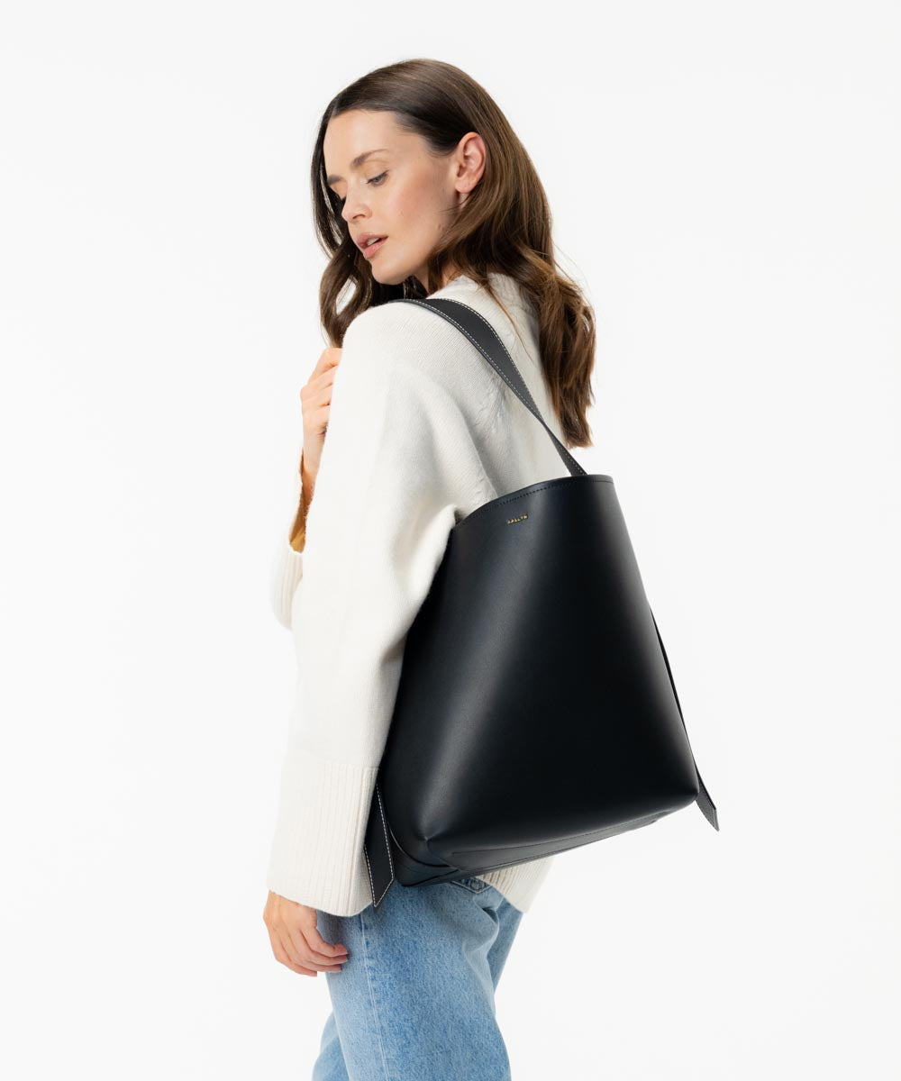 AALLYN Jolina bucket tote worn as a crossbody bag